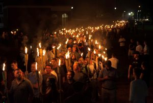 White nationalists carry torches on the grounds of the University of Virginia, on the eve of a planned Unite The Right rally in Charlottesville, Virginia, U.S. August 11, 2017. Picture taken August 11, 2017. Photo by Alejandro Alvarez/News2Share via REUTERS