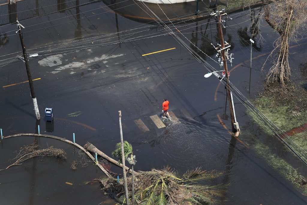 A street in San Juan, Puerto Rico remains flooded days after Hurricane Maria decimated the island. Photo by Joe Raedle/Get...