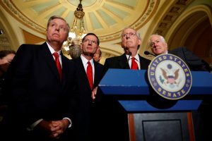 Senate Majority Leader Mitch McConnell, accompanied by (L-R) Sen. Lindsey Graham (R-SC), Sen. John Barrasso (R-WY) and Sen. John Cornyn (R-TX), speaks with reporters following the party luncheons on Capitol Hill in Washington, U.S., September 26, 2017. REUTERS/Aaron P. Bernstein - RC1578663BA0