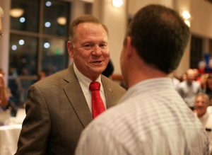 Republican candidate Roy Moore greets supporters during the runoff election for the Republican nomination for Alabama's U.S. Senate seat vacated by Attorney General Jeff Sessions, at the RSA Activity center in Montgomery, Alabama, U.S. September 26, 2017. REUTERS/Marvin Gentry - RC16FEBEBD10