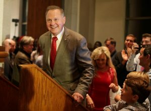 Republican candidate Roy Moore enters the stage to make his victory speech after defeating incumbent Luther Strange to his supporters at the RSA Activity center in Montgomery, Alabama, U.S. September 26, 2017, during the runoff election for the Republican nomination for Alabama's U.S. Senate seat vacated by Attorney General Jeff Sessions. REUTERS/Marvin Gentry - RC1A4F1B1750