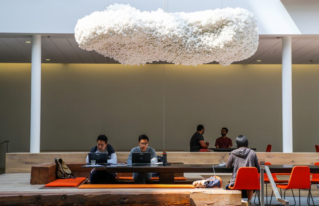 People worked in the lobby of the Airbnb office headquarters in the SOMA district of San Francisco, California, U.S., Augu...