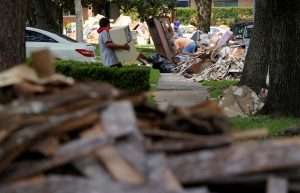 Giant mounds of trash from Hurricane Harvey flood damaged homes lines the sidewalks in Houston, Texas, U.S. September 2, 2017. REUTERS/Rick Wilking - RC122DDE7A50