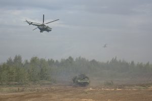 Helicopters and an armored vehicle are seen during the Zapad-2017 war games held by Russian and Belarussian servicemen on Sept. 14. Photo by Vayar military information agency/Belarussian Defense Ministry/Handout via Reuters