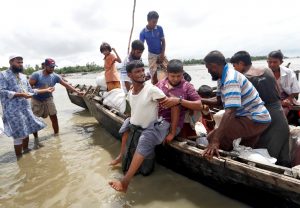 Rohingya refugees are seen in a boat after their arrival to Cox's Bazar, Bangladesh September 18, 2017. REUTERS/Cathal McNaughton - RC141C9723A0