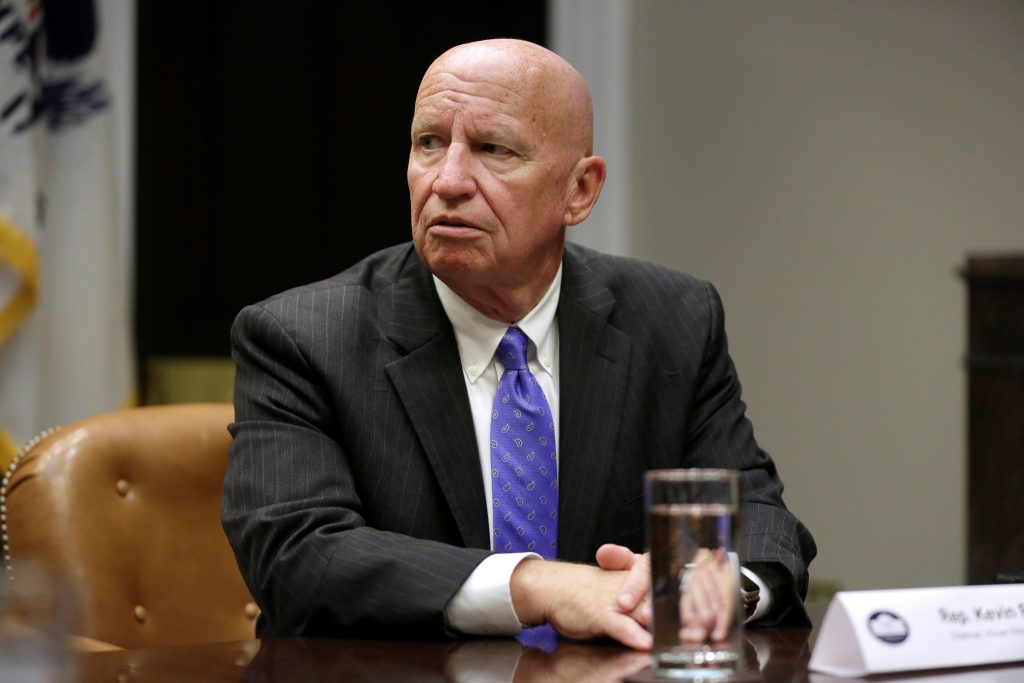 Chairman of the House Ways and Means Committee Kevin Brady (R-TX) listens as U.S. President Donald Trump speaks during a m...