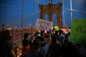 People march across the Brooklyn Bridge to protest the planned dissolution of DACA in New York City on Sept. 5. Photo by Stephen Yang/Reuters