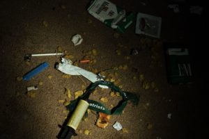 Drug paraphernalia and other garbage litter a vacant house on April 19, 2017 in Huntington, West Virginia. Huntington, the city in the northwest corner of West Virginia, bordering Kentucky, has been portrayed as the epicenter of the opioid crisis. On August 15, 2016, from 3:00 pm to 9:00 pm, 28 people in the city overdosed on heroin laced with fentanyl, a synthetic opioid far more powerful and dangerous than heroin. The economic incentives are powerful: one kilogram of fentanyl costs $5,000, which can make a million tablets sold at $20 each for a gain of $20 million. "This epidemic doesn't discriminate," Huntington Mayor Steve Williams said. "Our youngest overdose was 12 years old. The oldest was 77." / AFP PHOTO / Brendan Smialowski / TO GO WITH AFP STORY by Heather SCOTT, US-health-drugs-WestVirginia (Photo credit should read BRENDAN SMIALOWSKI/AFP/Getty Images)