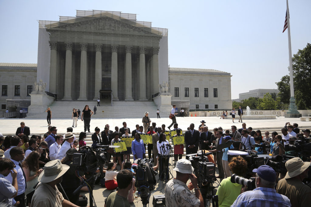 Representatives of the NAACP and other civil rights organizations speak to reporters after the U.S. Supreme Court struck d...