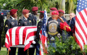 An honor guard carries the coffin of U.S. Army Sergeant La David Johnson, who was among four special forces soldiers killed in Niger, at a graveside service in Hollywood, Florida, October 21, 2017. REUTERS/Joe Skipper - RC119B87D780