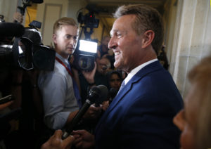 Sen. Jeff Flake (R-Ariz.) faces reporters after announcing he will not run for reelection on Capitol Hill in Washington, D.C. Photo by Joshua Roberts/Reuters