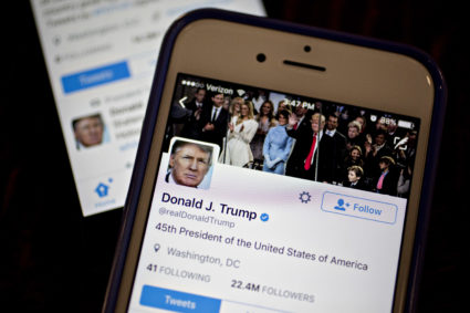 The Twitter accounts of President Donald Trump, @POTUS and @realDoanldTrump, are seen on smart phones arranged for a 2017 photograph. Andrew Harrer/Bloomberg via Getty Images