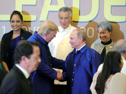 President Donald Trump and Russian President Vladimir Putin shake hands at the APEC summit in Danang, Vietnam on Nov. 10. Photo by Sputnik/Mikhail Klimentyev/Kremlin via Reuters