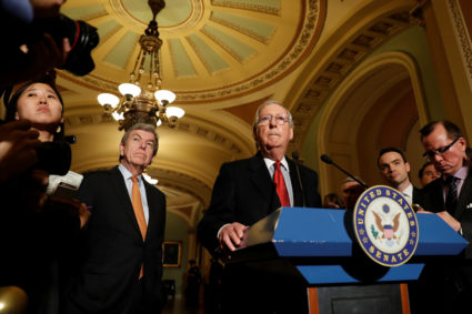 Senate Majority Leader Mitch McConnell, accompanied by Sen. Roy Blunt (R-MO), speaks with reporters following the party luncheons on Capitol Hill in Washington, U.S. November 14, 2017. REUTERS/Aaron P. Bernstein - RC1DDD4565A0