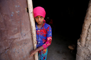 Saida Ahmad Baghili, 19, who is recovering from severe malnutrition, stands at the door of her family's hut in al-Tuhaitadistrict of the Red Sea province of Hodeidah, Yemen, October 20, 2017. REUTERS/Abduljabbar Zeyad.