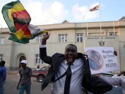 Zimbabweans celebrate after President Robert Mugabe resigns in Harare on Nov. 21. Photo by Mike Hutchings/Reuters