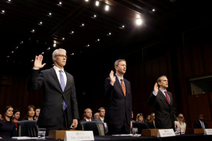 (L-R) Colin Stretch, general counsel for Facebook, Sean Edgett, acting general counsel for Twitter, and Richard Salgado, director of law enforcement and information security at Google, are sworn in prior to testifying before the Senate Intelligence Committee to answer questions related to Russian use of social media to influence U.S. elections, on Capitol Hill in Washington, U.S., November 1, 2017. REUTERS/Joshua Roberts TPX IMAGES OF THE DAY - RC17A80EE120