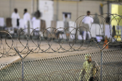 A Navy guard patrols Camp Delta?s detainee recreation yard during the early morning at Guantanamo Bay naval base in a July 7, 2010 file photo provided by the US Army. President Barack Obama urged lawmakers on Tuesday to give his plan to close the U.S. military prison at Guantanamo Bay, Cuba, a "fair hearing" and said he did not want to pass the issue to his successor when he leaves the White House next year. REUTERS/U.S. Air Force Tech. Sgt. Michael R. Holzworth/US Army/Handout via Reuters FOR EDITORIAL USE ONLY. NOT FOR SALE FOR MARKETING OR ADVERTISING CAMPAIGNS. THIS IMAGE HAS BEEN SUPPLIED BY A THIRD PARTY. IT IS DISTRIBUTED, EXACTLY AS RECEIVED BY REUTERS, AS A SERVICE TO CLIENTS - TM3EC2N0XDD01