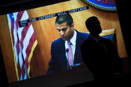 FCC Chairman Ajit Pai is seen on a screen before a vote to repeal Net Neutrality protections during a hearing at the Federal Communications Commission December 14, 2017 in Washington, DC. / AFP PHOTO / Brendan Smialowski (Photo credit should read BRENDAN SMIALOWSKI/AFP/Getty Images)