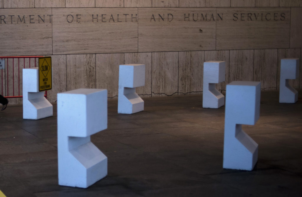 A worker arrives at the Department of Health and Human Services on Tuesday morning after the federal government was shutdo...