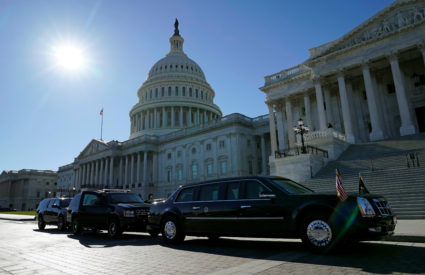 FILE PHOTO: The Presidential motorcade awaits the departure of U.S. President Donald Trump from the U.S. Capitol in Washington, DC, U.S. on November 28, 2017. REUTERS/Kevin Lamarque/File Photo - RC1D221C4C20