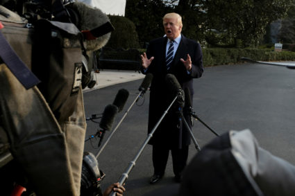 U.S. President Donald Trump speaks to reporters before departing the White House for New York in Washington