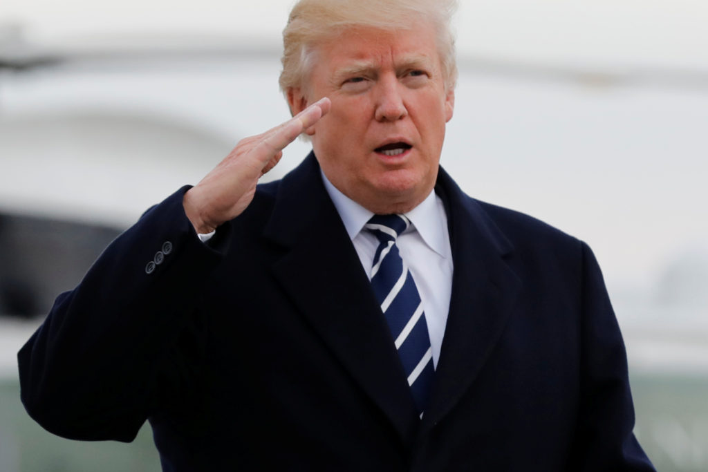U.S. President Donald Trump salutes as he boards Air Force One at John F. Kennedy International Airport in New York, befor...