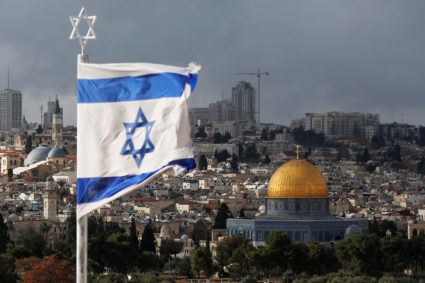 An Israeli flag is seen near the Dome of the Rock, located in Jerusalem's Old City on the compound known to Muslims as Noble Sanctuary and to Jews as Temple Mount on Dec. 6, 2017. Photo by Ammar Awad/Reuters