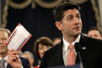 FILE PHOTO: Speaker of the House Paul Ryan (R-WI) holds a sample tax form as he unveils legislation to overhaul the tax code on Capitol Hill in Washington, U.S., November 2, 2017. REUTERS/Joshua Roberts/File Photo - RC19B2138BE0