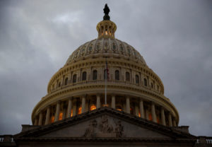 FILE PHOTO: The U.S. Capitol building is lit at dusk ahead of planned votes on tax reform in Washington, U.S., December 18, 2017. REUTERS/Joshua Roberts/File Photo - RC1ED69973F0