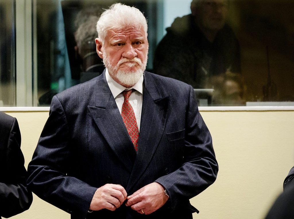 Croatian former general Slobodan Praljak stands prior to the start of his appeal judgement at the International Criminal Tribunal for the former Yugoslavia (ICTY) on November 29, 2017 