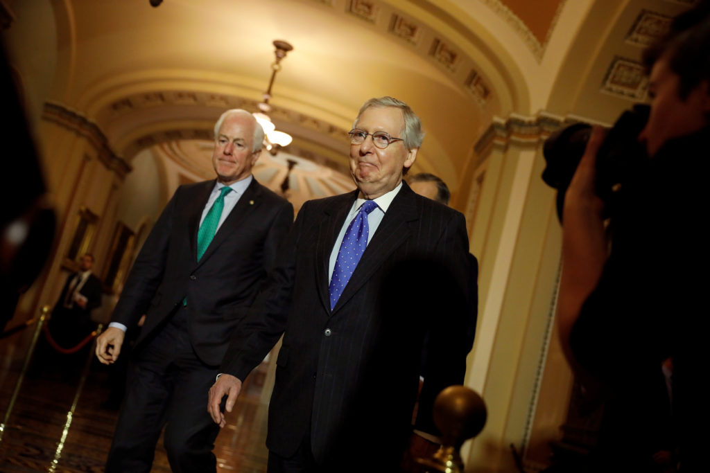 Senate Majority Leader Mitch McConnell and Sen. John Cornyn arrive to speak about the Tax Cuts and Jobs Acts at news confe...