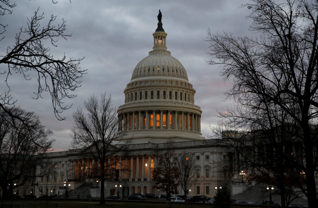 The U.S. Capitol building is lit at dusk ahead of planned votes on tax reform in Washington, U.S., December 18, 2017. REUT...