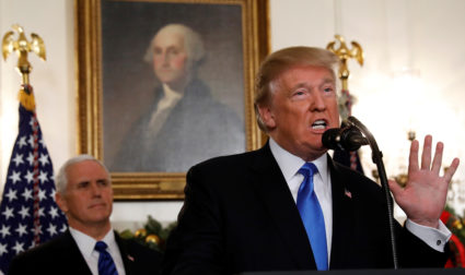 U.S. Vice President Mike Pence listens as U.S. President Donald Trump announces that the United States recognizes Jerusalem as the capital of Israel and will move its embassy there, during an address from the White House in Washington, U.S., December 6, 2017. REUTERS/Kevin Lamarque - RC1A53989780