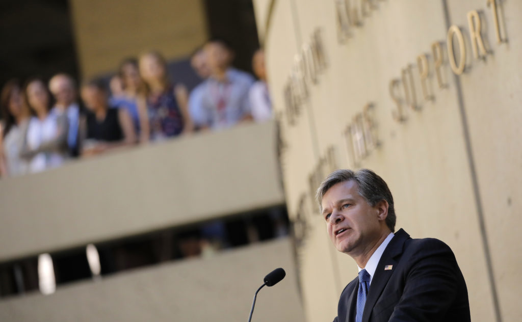 FBI Director Christopher Wray speaks to FBI employees during his installation ceremony at the agency's headquarters in Was...