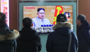 People watch a TV broadcasting a news report on North Korea's leader Kim Jong Un speaking during a New Year's Day speech, in Seoul, South Korea, in January. Yonhap via Reuters