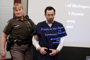 FILE PHOTO: Larry Nassar, a former team USA Gymnastics doctor who pleaded guilty in November 2017 to sexual assault charges, returns from a break to listen to victim testimony in the courtroom during his sentencing hearing in Lansing, Michigan. Photo by REUTERS/Brendan McDermid/File Photo.