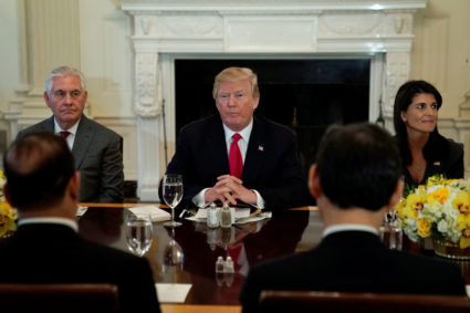 U.S. President Donald Trump, seated with Secretary of State Rex Tillerson and U.S. Ambassador to the United Nations Nikki Haley, plays host to a lunch for ambassadors to the United Nations Security Council at the White House in Washington, U.S. January 29, 2018. REUTERS/Jonathan Ernst - RC1CA4606E00