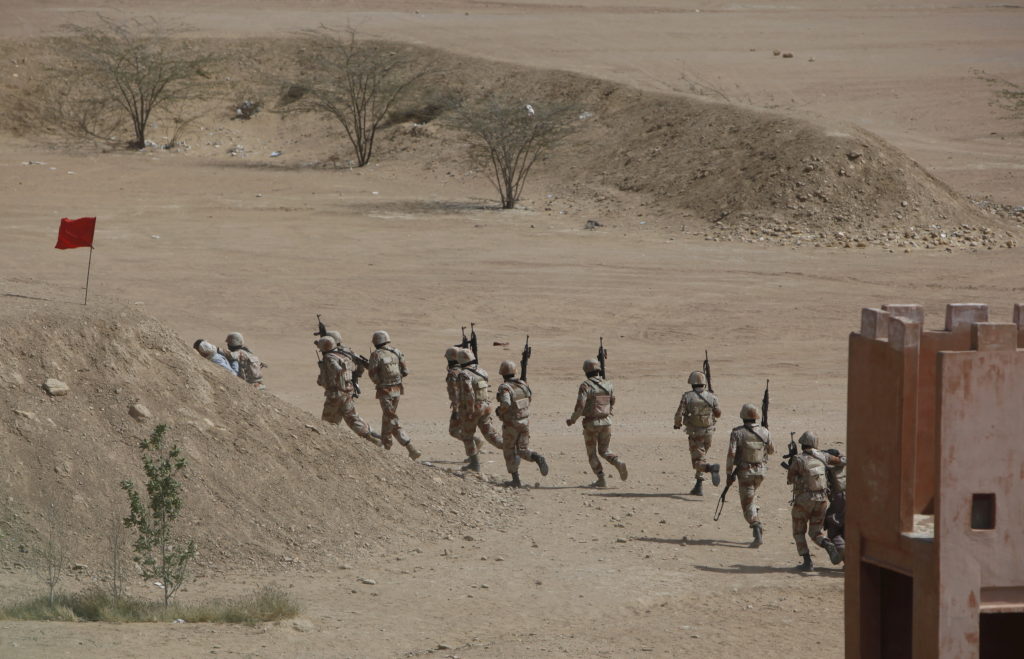 Pakistan Rangers walk with their weapons during a 2015 counter-terrorism training demonstration at the Rangers Shooting & ...