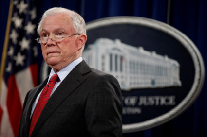 FILE PHOTO: U.S. Attorney General Jeff Sessions stands during a news conference to discuss "efforts to reduce violent crime" at the Department of Justice in Washington, U.S., December 15, 2017. REUTERS/Joshua Roberts/File Photo - RC1124977980
