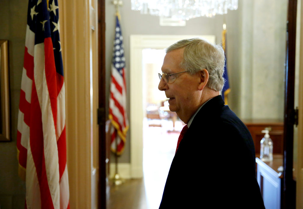 Senate Majority Leader Mitch McConnell (R-KY) walks from the Senate floor after President Donald Trump and the U.S. Congre...