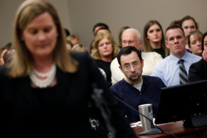 Prosecutor Angela Povilaitis speaks at the sentencing hearing for Larry Nassar, a former team USA Gymnastics doctor who pleaded guilty in November 2017 to sexual assault charges, in Lansing, Michigan, U.S., January 24, 2018. REUTERS/Brendan McDermid - RC1C69A9EF90