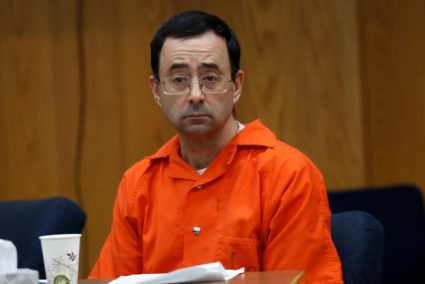 Larry Nassar, a former team USA Gymnastics doctor who pleaded guilty in November 2017 to sexual assault, listens to victims impact statements during his sentencing in the Eaton County Circuit Court in Charlotte, Michigan. Photo by Rebecca Cook/Reuters