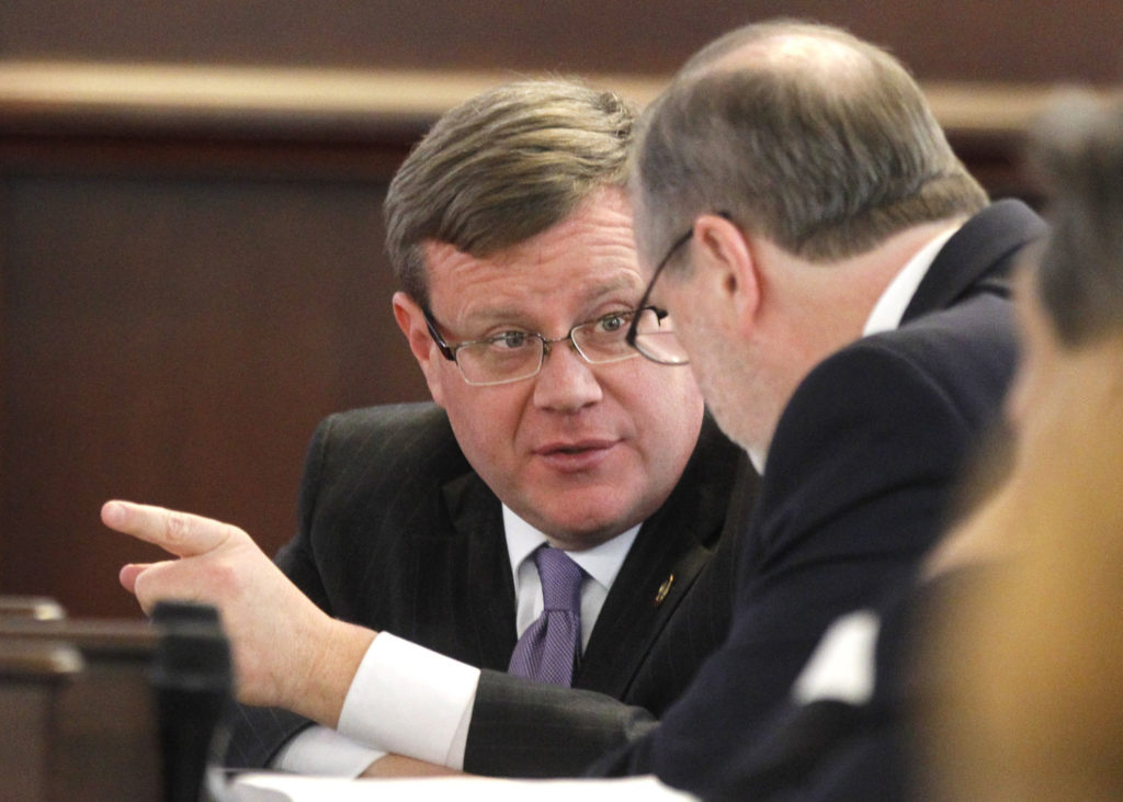 North Carolina Speaker of the House Tim Moore, left, confers with President Pro Tempore Phil Berger in the Senate chambers...