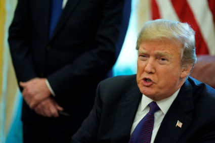 U.S. President Donald Trump speaks to reporters after signing directives to impose tariffs on imported washing machines and solar panels before signing it in the Oval Office at the White House in Washington, U.S. January 23, 2018. REUTERS/Jonathan Ernst - RC1C63CA38E0