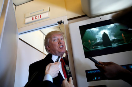 U.S. President Donald Trump talks to journalists, members of the travel pool, on board Air Force One during his trip to Palm Beach, Florida, U.S., April 6, 2017. Carlos Barria: "During the many trips to President Trump's residence in Florida it is usual to see the president coming to the back of the plane to chat with journalists. During one of the trips to the so called 'Winter White House', Trump had a long talk with reporters while the Air Force One entertainment system was playing one of the latest Star Wars movies. As I was listening to Trump talk I was also looking at the movie waiting for a part of the movie to frame the mood of the day. Of the many scenes, I choose the one with Darth Vader." REUTERS/Carlos Barria/File Photo SEARCH "POY TRUMP" FOR THIS STORY. SEARCH "REUTERS POY" FOR ALL BEST OF 2017 PACKAGES. TPX IMAGES OF THE DAY FOR EDITORIAL USE ONLY. NO RESALES. NO ARCHIVES - RC173AD44C00 - RC19120B8D50