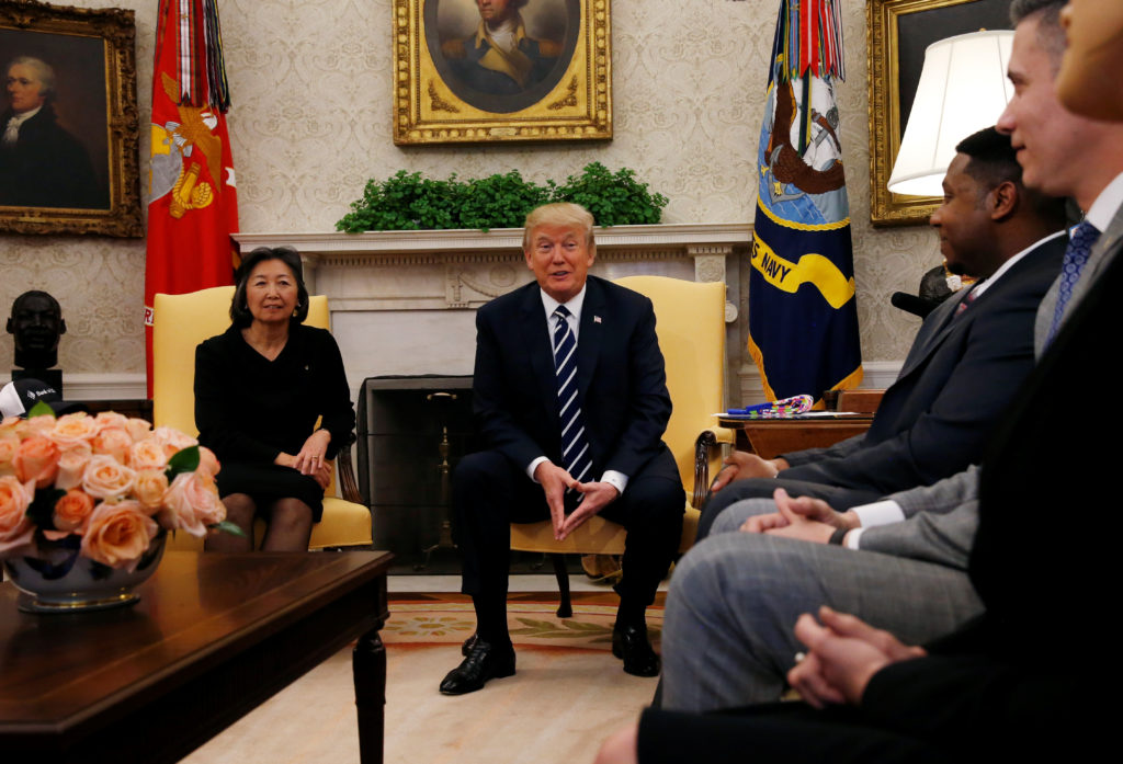 U.S. President Donald Trump talks with workers employed by companies who increased pay and benefits after the recent tax legislation in the White House in Washington, U.S., January 31, 2018. REUTERS/Leah Millis - RC17827146B0