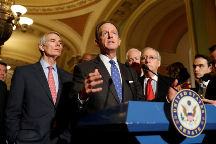 Sen. Pat Toomey (R-PA), accompanied by Sen. Rob Portman (R-OH) and Senate Majority Leader Mitch McConnell, speaks with reporters following the party luncheons on Capitol Hill in Washington, U.S. November 14, 2017. REUTERS/Aaron P. Bernstein - RC1317588840