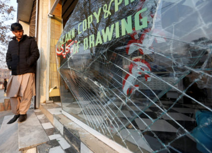 An Afghan shopkeeper surveys the damages caused by a bomb attack in Kabul on Jan. 28. Photo by Omar Sobhani/Reuters