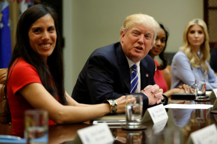 U.S. President Donald Trump (C), flanked by Trumbull Unmanned CEO Dyan Gibbens (L), Johnson Security Bureau President Jessica Johnson (2nd R) and Ivanka Trump (R), meets with women small business owners at the White House in Washington, U.S., March 27, 2017. REUTERS/Jonathan Ernst - RC1C831FA580